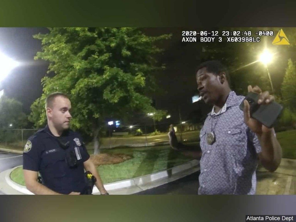 Body cam footage of Rayshard Brooks speaking with Officer Garrett Rolfe in the parking lot of a Wendy's restaurant in Atlanta