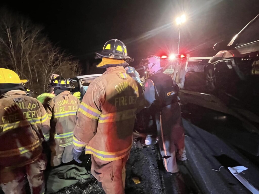 Firefighters working crash