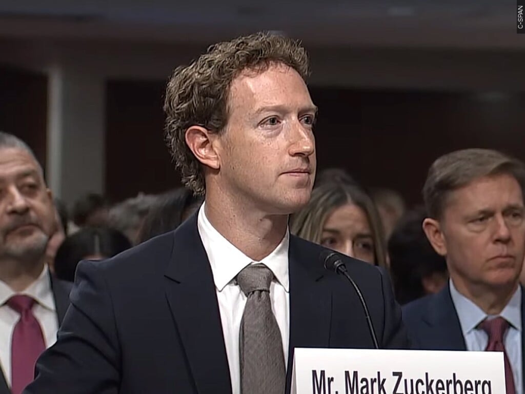 Mark Zuckerberg, META CEO listens to Josh Hawley United States Senator for Missouri speak during a Senate Judiciary hearing