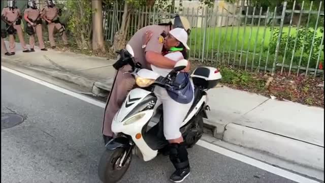 Fl: Protests: Trooper Breaks Line To Hug Woman