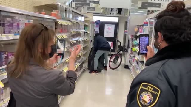 Ca: Thief Fills Bag In Front Of Security (on Cam)