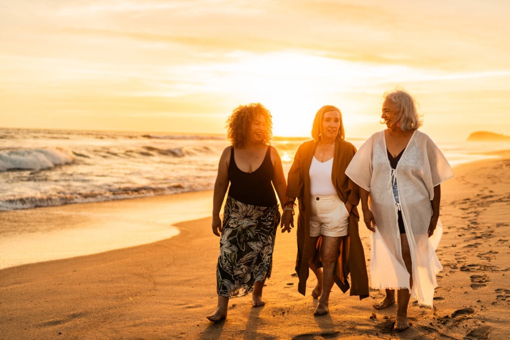 Senior Friends Women Walking On The Beach