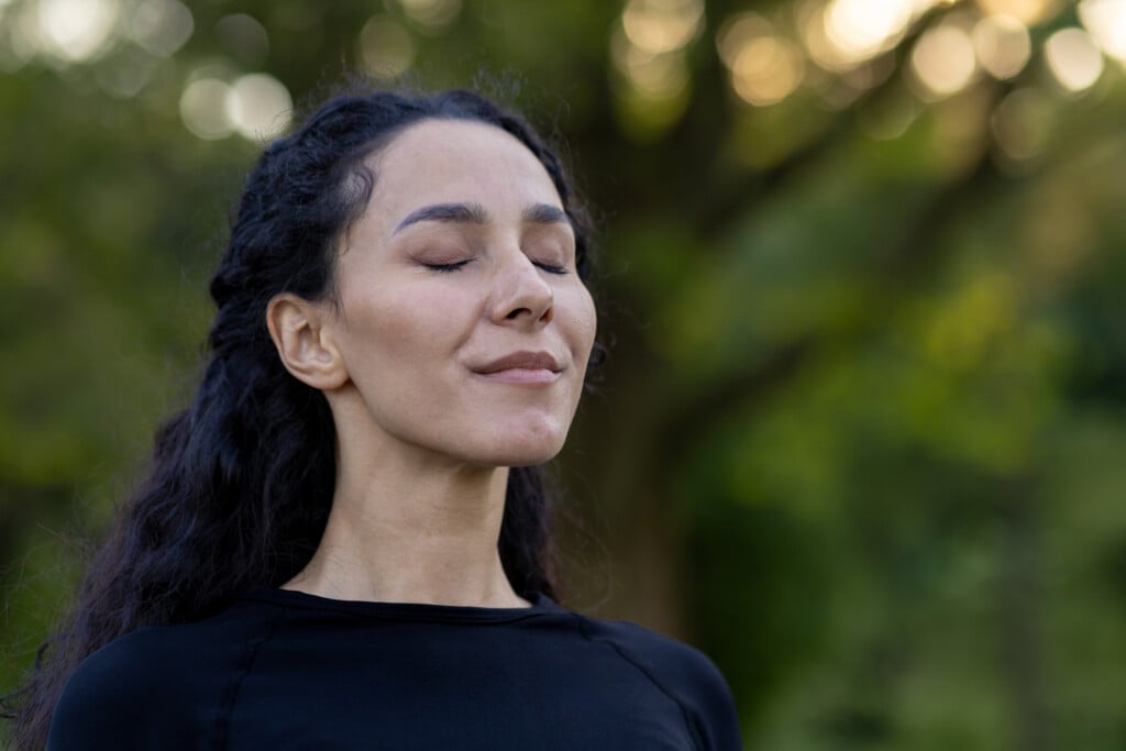 Hispanic Woman Enjoying A Peaceful Moment In Nature