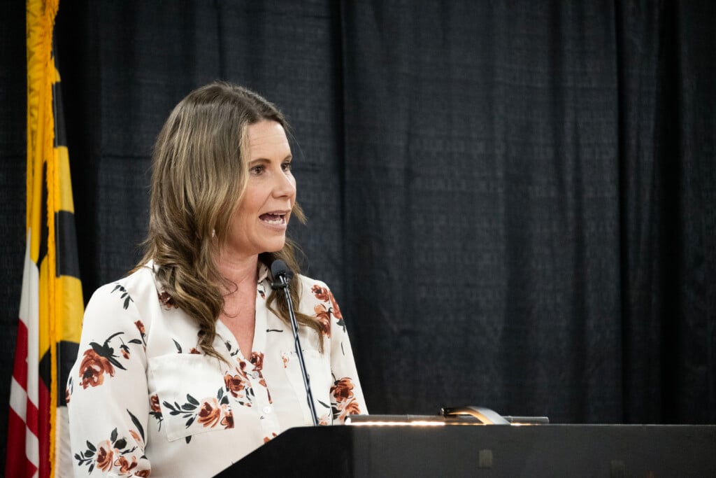 Wicomico County Executive Julie Giordano speaks at a podium with the Maryland flag behind her to deliver the State of County Address.
