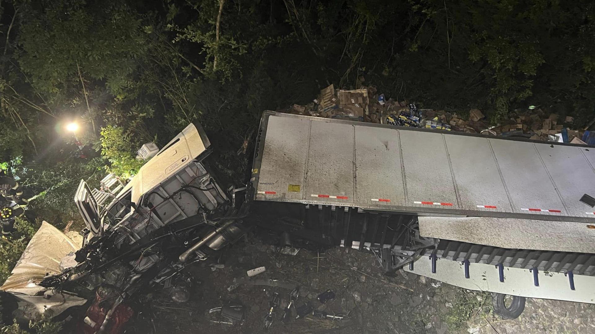 Tractortrailer crashes into bridge off of I65, lands on bank of river