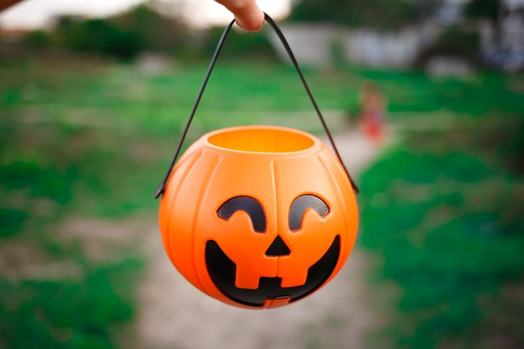 Hand Holding A Pumpkin Basket For Halloween 2024 11 25 16 51 53 Utc