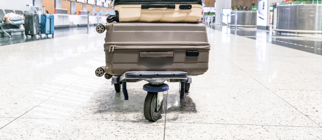 Young Woman Traveling Solo.traveller Alone At The Airport With S