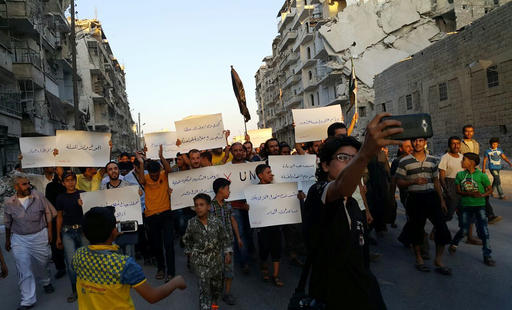 Activists in Syrias besieged Aleppo protest against the United Nations for what they say is its failure to lift the siege off their rebel-held area