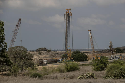 Heavy machinery is seen on the Israeli side of the border with Gaza Thursday