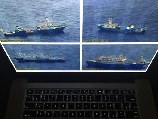 Photographs released by the Philippine government are displayed on a computer screen in Bangkok