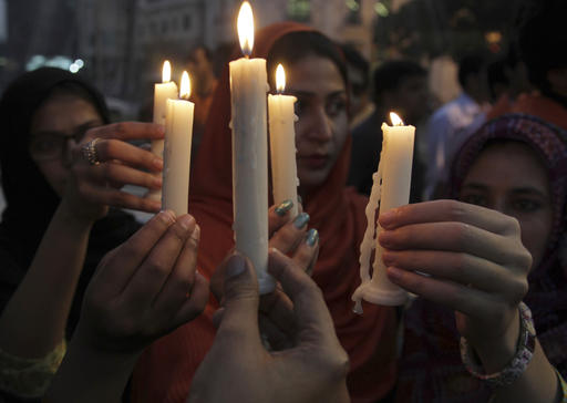 People attend a candlelight vigil for the victims of an overnight attack on the Quetta Police Training Academy