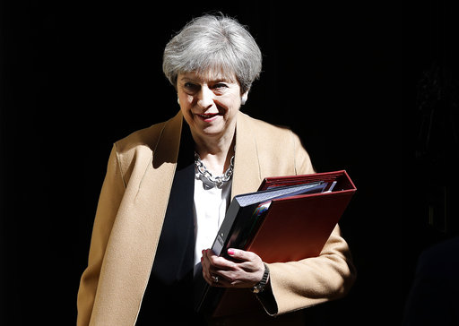 Britain's Prime Minister Theresa May departs 10 Downing Street in London  for Prime Minister's Questions in the Houses of Parliament Wednesday