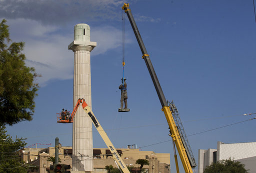 A statue of Confederate General Robert E. Lee is removed from Lee Circle Friday