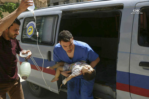 This photo provided by the Syrian anti-government activist group Ghouta Media Center