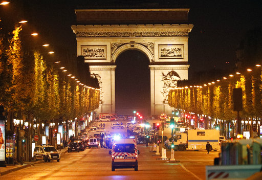 Police forces take positions on the Champs Elysees avenue in Paris