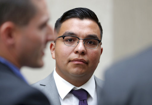 St. Anthony police officer Jeronimo Yanez stands outside the Ramsey County Courthouse while waiting for a ride Tuesday