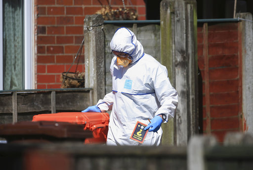 Police forensic investigators search the property of Salmon Abedi in connection with the explosion that took place at the Manchester Arena