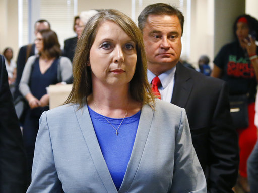 Betty Shelby leaves the courtroom with her husband