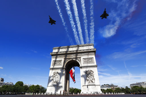 French war planes fly over the Arc de Triomphe in Paris