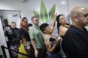 People wait in line at the Essence cannabis dispensary