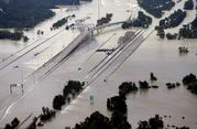 Interstate 69 is covered by floodwaters at the San Jacinto River bridge as floodwaters from Tropical Storm Harvey caused the river to overflow Tuesday