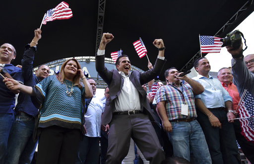 Puerto Rico Governor Ricardo Rossello celebrates the results of a referendum on the status of the island
