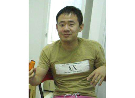 This 2009 handout photo released by a friend of Xiyue Wang shows Xiyue Wang at his apartment in Hong Kong
