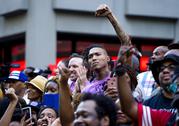 People gather in support of unsigned NFL quarterback Colin Kaepernick on Wednesday
