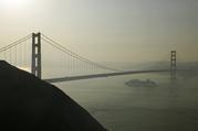 A cruise ship passes beneath the Golden Gate Bridge as smoke from wildfires blankets the San Francisco skyline Tuesday