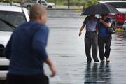 A couple arrive at a store to purchase supplies in preparation for Hurricane Irma