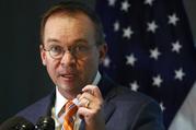Mick Mulvaney speaks during a news conference after his first day as acting director of the Consumer Financial Protection Bureau in Washington