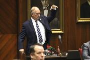 Arizona Republican state Rep. Don Shooter drops his mic after voting no on a resolution expelling him from the Arizona House for a pattern of sexual harassment in Phoenix