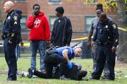 Police respond to a crime scene after an assailant fired multiple rounds into a park and playground