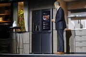 LG's David Vander Waal introduces the InstaView ThinQ smart refrigerator during a news conference at CES International