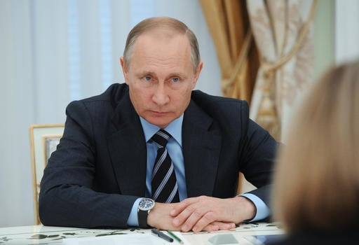 Russian President Vladimir Putin meets with members of Central Election Commission in Moscow's Kremlin