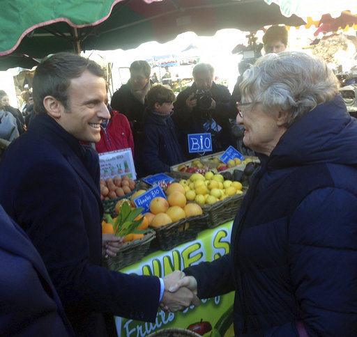 French centrist presidential candidate Emmanuel Macron visits a market in Poitiers