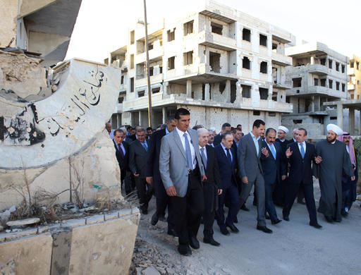 In this photo released by the Syrian official news agency SANA