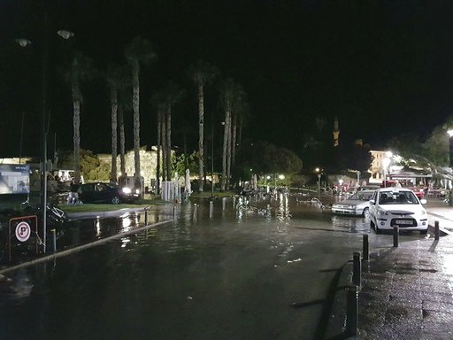 Damage and flooding are seen on a coastal road following a strong earthquake on the Greek island of Kos early Friday