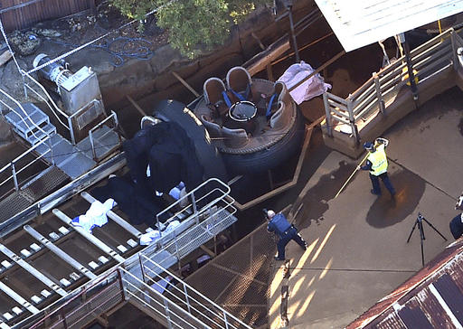 Queensland Emergency Services personnel are seen at the Thunder River Rapids ride at Dreamworld on the Gold Coast