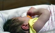 A week old baby lies in one of the ICU bays at one of the Norton Children's Hospital neonatal intensive care units Tuesday