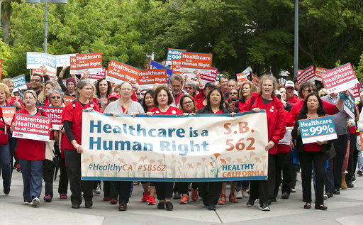 Supporters of single-payer health care march to the Capitol Wednesday