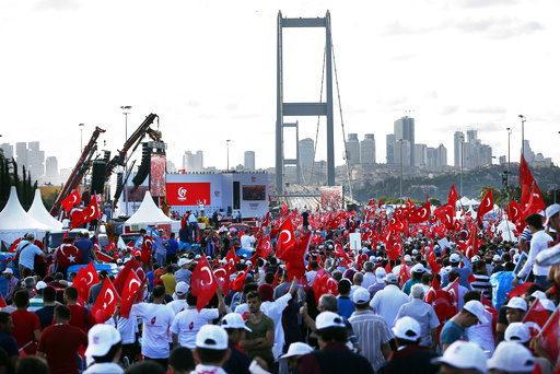 People gather at the July 15 Martyr's bridge on a "National Unity March" to commemorate the one year anniversary of the July 15