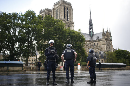 Police officers seal off the access to Notre Dame cathedral in Paris