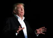 President Donald Trump speaks to reporters about Puerto Rico upon his return to the White House in Washington