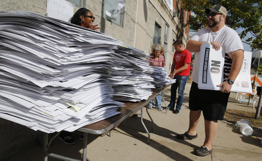 Stacks of picket signs wait for Chicago Teachers Union members to pick up outside union's strike headquarters Monday