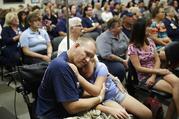 Las Vegas shooting victim Kurt Fowler embraces his 10-year-old daughter Timori Fowler during a country music performance at Sunrise Hospital