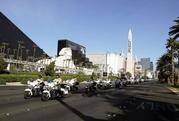 The funeral procession for Las Vegas police officer Charleston Hartfield drives down the Las Vegas Strip Friday