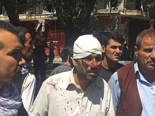 An injured man is seen after a suicide attack in Kabul