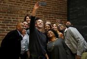 Facebook CEO Mark Zuckerberg takes a selfie with a group of entrepreneurs and innovators after taking part in a roundtable discussion at Cortex Innovation Community technology hub