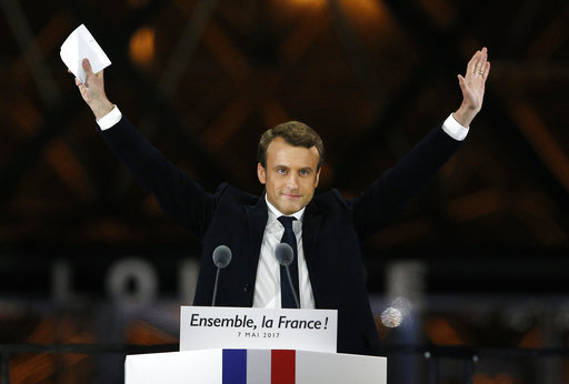 French President-elect Emmanuel Macron gestures during a victory celebration outside the Louvre museum in Paris